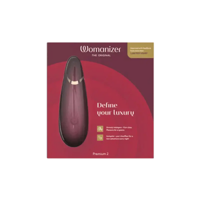 Womanizer Premium 2 air-pulse clitoral stimulator in bordeaux with its packaging