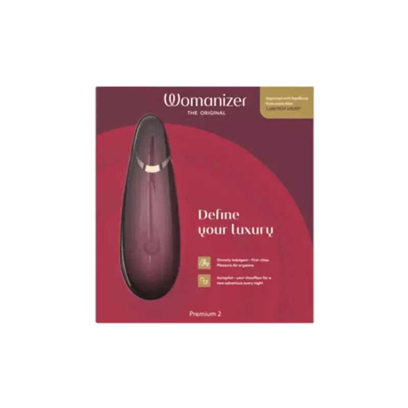 Womanizer Premium 2 air-pulse clitoral stimulator in bordeaux with its packaging