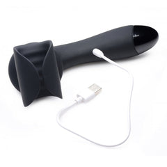 10X Solo Stroke Wand lying flat with white USB magnetic charging cable attached to port