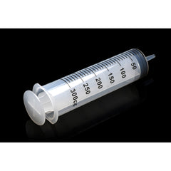 300cc enema syringe with tapered tip, transparent barrel and measurement markings, black background