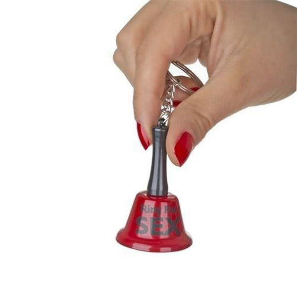 Hand holding small red Ring For Sex bell keychain by its black handle to ring it