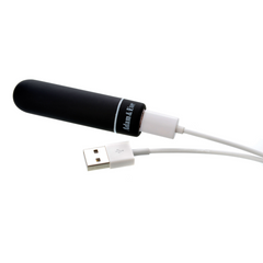 Adam & Eve bullet vibrator connected to USB charging cable showing rechargeable functionality