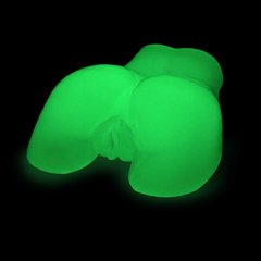Adam & Eve Peek-A-Booty masturbator glowing bright green in complete darkness