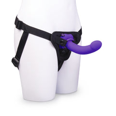 Adjustable black strap-on harness worn on mannequin with purple curved dildo attached