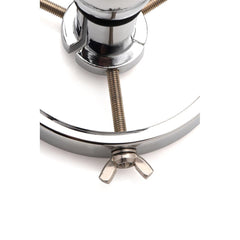 Close-up of adjustable wing-nut thumbscrew and threaded rod on Forced Spread speculum
