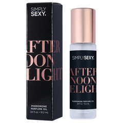 Afternoon Delight roll-on perfume oil beside its matte black rectangular gift box with rose gold lettering