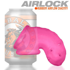 Airlock pink chastity cage shown beside a standard beverage can to indicate product scale