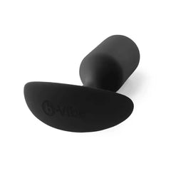 Angled view of b-Vibe Snug Plug 3 displaying ergonomic anchor base with embossed brand logo