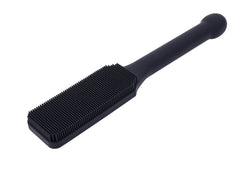 Angled front view of Sportsheets silicone paddle with dense pin-point bristle surface
