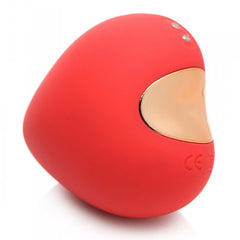 Angled view of the Heart's Desire showing gold-accent interior, two control buttons, and CE certification mark