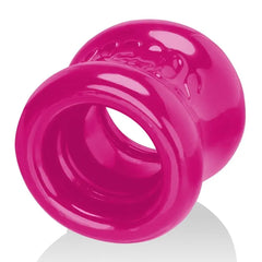 Angled close-up of hot pink Squeeze Ball Stretcher highlighting thickened outer rim