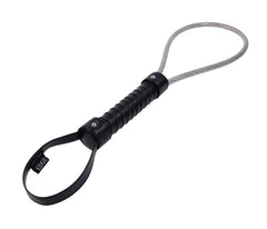 Angled view of Metal Loop Spanker displaying leather wrist strap, riveted bands, and steel loop