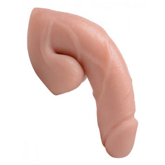 Angled close-up of packer dildo tip showing lifelike detail and flexible pliable material