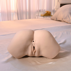 Angled rear view on white bedding showing the water-fill valve port and realistic contoured surface detail