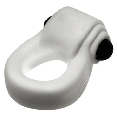 Angled close-up of REVRING white silicone ring showing REVERB text and vibe button