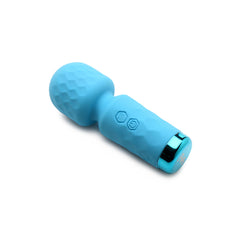 Angled side view of blue mini wand showing honeycomb-textured head, dual buttons, and chrome base ring