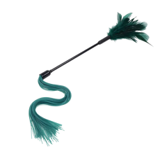 Angled view of the tickler highlighting the flowing teal silicone strands and compact feather top