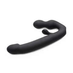 Angled view of Tri-Volver strap-on highlighting smooth matte silicone finish and ergonomic curve