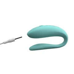 Aqua We-Vibe Sync Lite couples vibrator with magnetic charging cable connected