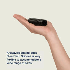 Arcwave Ghost compact black stroker resting on palm, showing flexible CleanTech silicone sleeve
