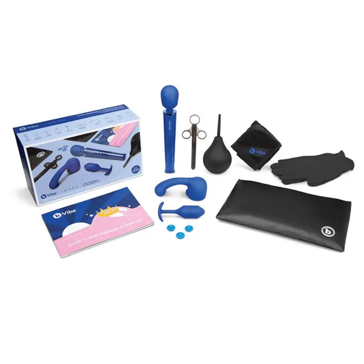 b-Vibe Anal Massage & Education Set laid out with wand, plug, attachments, and travel bag