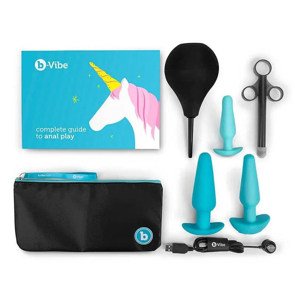 b-Vibe Anal Training Kit with three teal silicone plugs, enema bulb, lube launcher, storage pouch, and guide