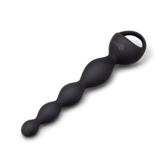 b-Vibe black silicone vibing beads laid at angle, highlighting smooth graduated bead progression