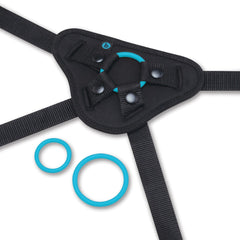 Close-up of b-Vibe harness front panel with snap closures and two teal silicone O-rings
