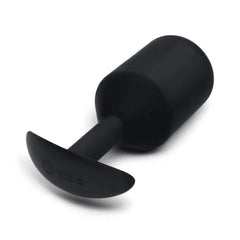 b-Vibe logo on anchor base of black silicone plug shown from low angle on white surface