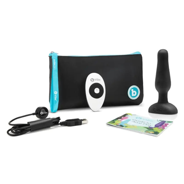 b-Vibe Novice Plug kit with black silicone plug, remote, USB cable, pouch, and guide