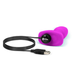 B-Vibe Rimming Plug Petite base with magnetic USB charging cable attached for rechargeable convenience