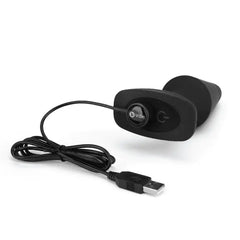 b-Vibe Rimming Plug XL base and remote connected via magnetic USB charging cable