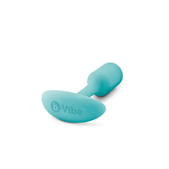 b-Vibe Snug Plug 1 lying on its side revealing oval anchor base with embossed brand logo