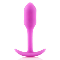 b-Vibe Snug Plug 1 pink weighted silicone anal plug, front view showing tapered tip