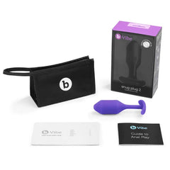b-Vibe Snug Plug 2 displayed with storage pouch, user guide, and anal play booklet
