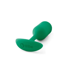 b-Vibe Snug Plug 2 lying on side showing oval anchor base with embossed logo