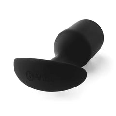 Close-up of b-Vibe Snug Plug 5 base showing curved anchor design and embossed brand logo