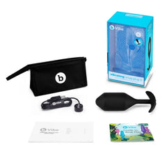 b-Vibe Snug Plug 5 unboxed with storage pouch, charging cable, and printed guides