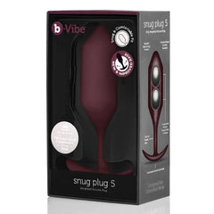 b-Vibe Snug Plug 5 weighted silicone anal plug shown in dark red retail packaging