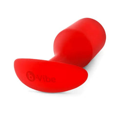 b-Vibe Snug Plug 6 laying flat showing ergonomic curved anchor base with logo detail