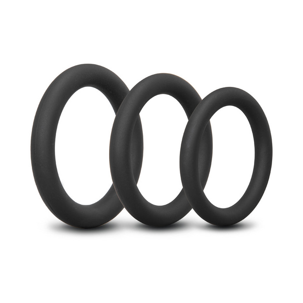 b-Vibe Snug Ring Lite 3-pack black silicone cock rings arranged in overlapping stack
