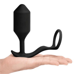 b-Vibe Snug & Tug XL balanced on open palm to show overall size and weight