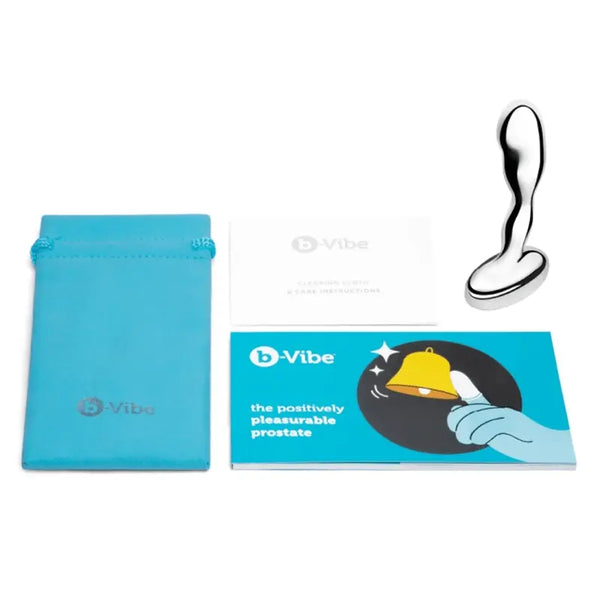 b-Vibe stainless steel prostate plug shown with teal storage pouch and instruction booklet