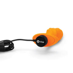 b-Vibe Swirl plug lying flat with magnetic USB charging cable connected to base