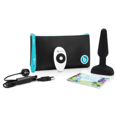 b-Vibe Trio Plug black silicone anal plug shown with remote, USB cable, pouch, and guide