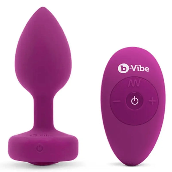 b-Vibe Vibrating Jewel Plug in berry purple silicone shown with oval wireless remote control