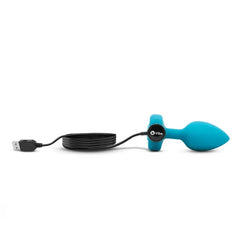 b-Vibe Vibrating Jewel Plug connected to USB charging cable via magnetic base port