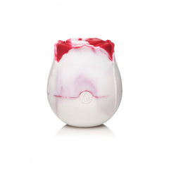 Back view of marbled red and white silicone rose stimulator showing magnetic charging port