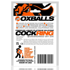 Back of Oxballs COCK-T packaging listing silicone material, care instructions, and certifications