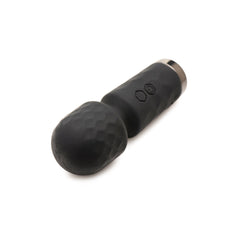 Bang 10X Mini Silicone Wand lying on side, showing textured head and gunmetal base cap